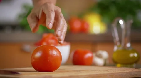 Cutting tomatoes. a part in slow motion Stock Footage 52921013