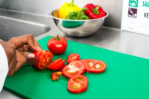 Cutting tomatoes Stock Photos