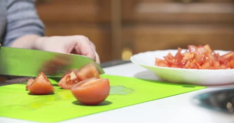 Cutting Tomatoes into Quarters Close-Up Stock Footage 304882870