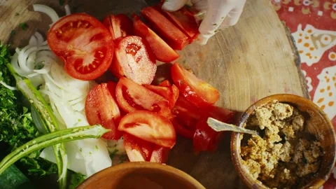 Cutting tomatoes for vegetables salad Stock Footage 138127823