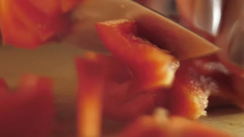 Cutting tomatoes on wooden Board Stock Footage