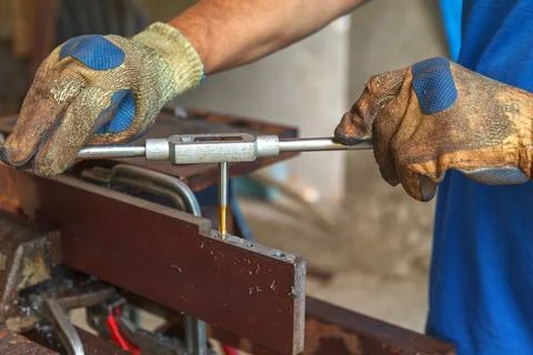 Cutting tool. Threading in the hole Stock Photos