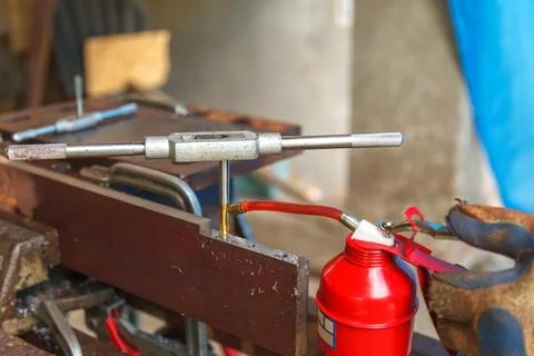 Cutting tool. Threading in the hole Stock Photos