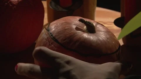 Cutting top of Halloween pumpkin with big knife by drawn contour line Stock Footage