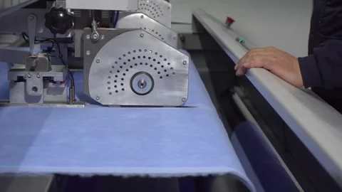 Cutting the towel with automatic knives Stock Footage 245493190