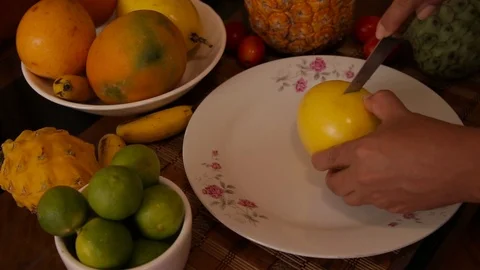 Cutting a tropical fruit Stock Footage 103033340