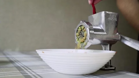 Cutting vegetables chilli peppers in mechanical meat grinder Stock-Footage 159199059