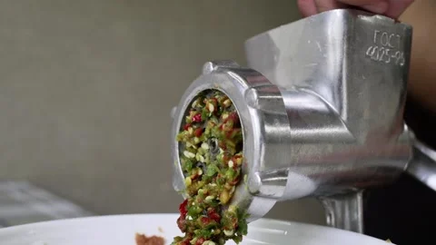 Cutting vegetables chilli peppers in mechanical meat grinder Stock-Footage 159199110