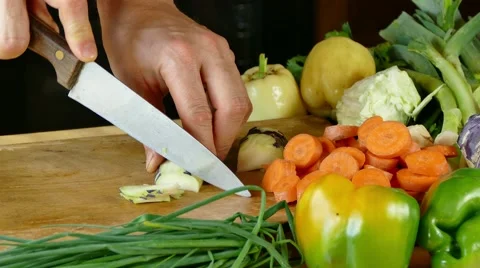 Cutting vegetables on desk in the kitchen Stock Footage 68065954