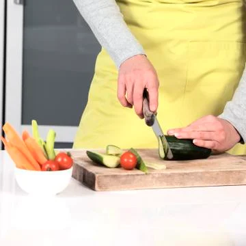 Cutting vegetables at home Stock Photos