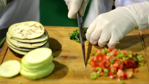 Cutting vegetables in kitchen Stock Footage 70727406