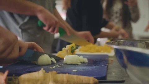 Cutting vegetables in kitchen Stock Footage 82230914