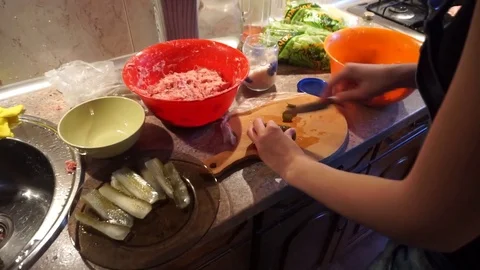 Cutting vegetables in a kitchen Stock Footage 110575617