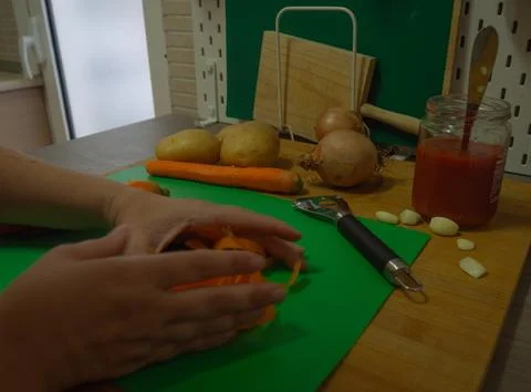 Cutting vegetables in the kitchen Stock Photos