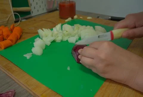 Cutting vegetables in the kitchen Stock Photos