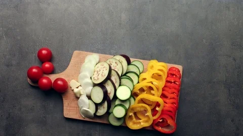Cutting vegetables, kitchen table, top view - stop motion animation Stock Footage 73275439