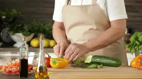 Cutting vegetables for salad Stock Footage 10868050