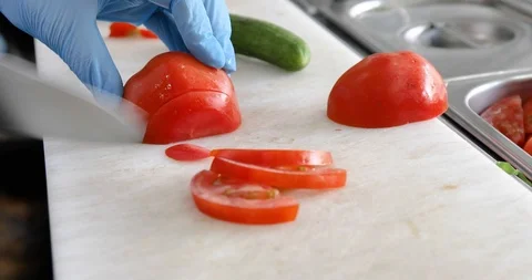Cutting vegetables tomato and cucumber Stock Footage