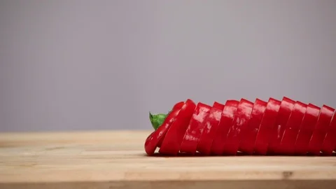 Cutting vegetables on wooden cutting board. Food stop motion animation. Stock Footage