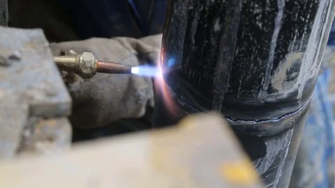 Cutting vertical pipe for well with torch Stock Footage 77278424