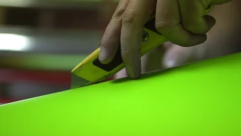 Cutting Vinyl with a Utility Knife Stock Footage 76103783