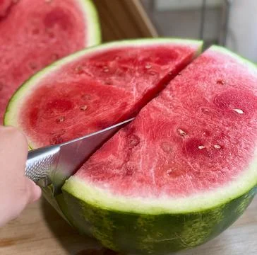 Cutting watermelon Stock Photos