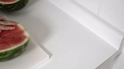 Cutting a Watermelon. Preparing to eat. 4K UHD. Stock Footage 77079447