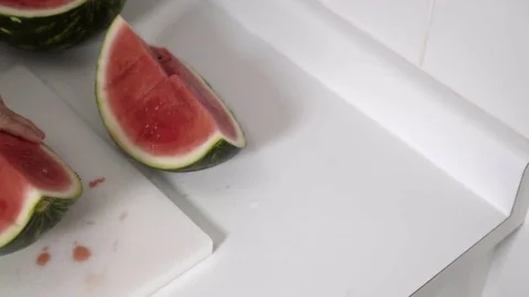 Cutting a Watermelon. Preparing to eat. 4K UHD. Stock Footage 77079510
