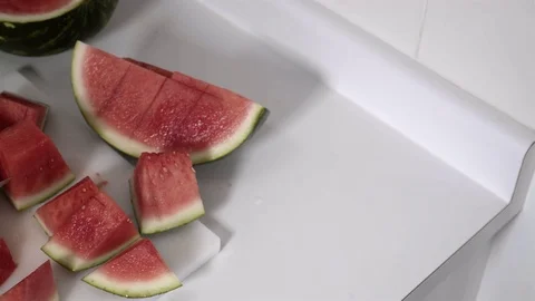 Cutting a Watermelon. Preparing to eat. 4K UHD. Stock Footage 77079685