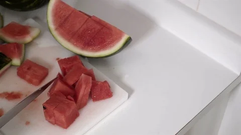 Cutting a Watermelon. Preparing to eat. 4K UHD. Stock Footage 77079969