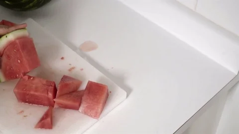 Cutting a Watermelon. Preparing to eat. 4K UHD. Stock Footage 77080158
