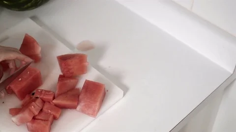 Cutting a Watermelon. Preparing to eat. 4K UHD. Stock Footage 77080209