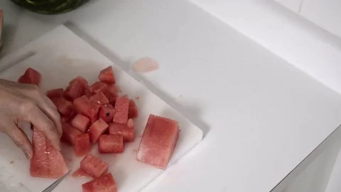 Cutting a Watermelon. Preparing to eat. 4K UHD. Stock Footage 77080310