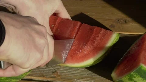 Cutting watermelon from top Stock Footage 144739373