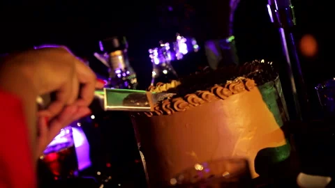 Cutting a wedding cake with a knife Stock Footage 253793099