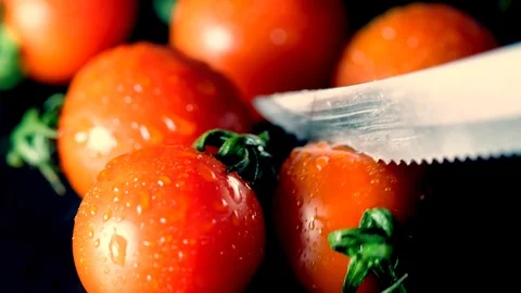 Cutting wet tomatoes Stock Footage 100022891