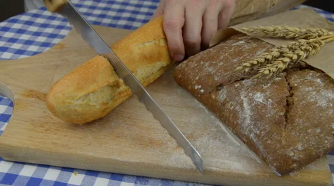 Cutting White and Dark Bread Stock Footage 62887677