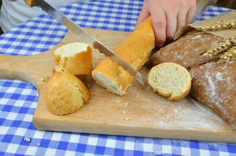 Cutting White and Dark Bread Stock Photos