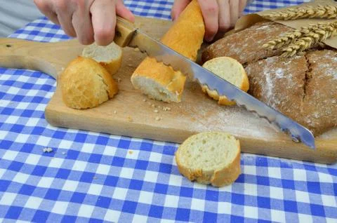 Cutting White and Dark Bread Stock Photos