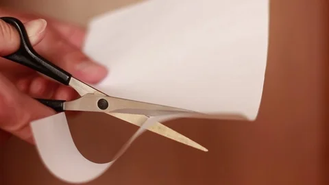 Cutting white paper with scissors Stock Footage 74292167
