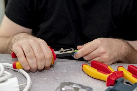 Cutting wire by nippers Stock Photos