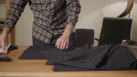 Cutting wool fabric. the line pattern. Bow ties of woolen fabric. Young man Stock Footage 83039282