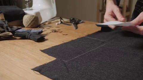 Cutting wool fabric. the line pattern. Bow ties of woolen fabric. Young man Stock Footage 83041766