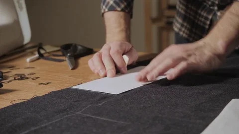 Cutting wool fabric. the line pattern. Bow ties of woolen fabric. Young man Stock Footage 83042054