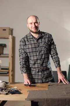 Cutting wool fabric. the line pattern. Bow ties of woolen fabric. Young man Stock Photos