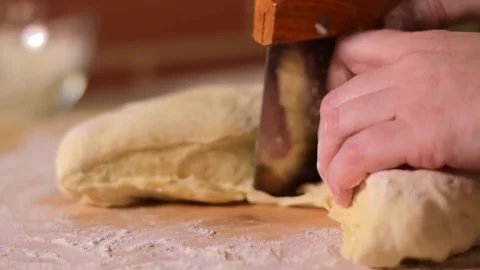 Cutting yeast dough with dough scraper Stock Footage 168680289