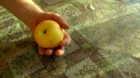 Cutting of yellow apple on four equal parts by means of a knife Stock Footage