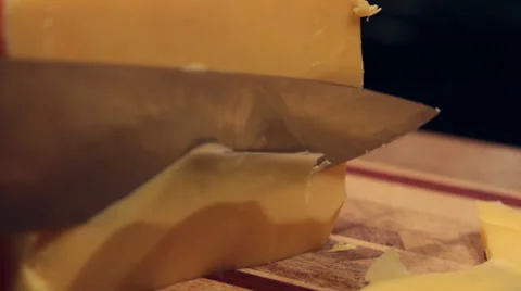 Cutting Yellow, Cheddar Cheese - Close Up Video stock 34481234