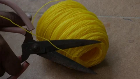 Cutting Yellow Nylon Rope with Scissors Vídeos de archivo 340424873