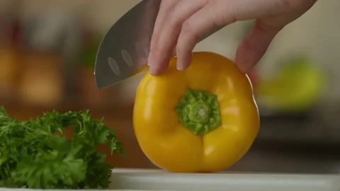Cutting A Yellow Pepper In Half 4K Stock Footage 193315897